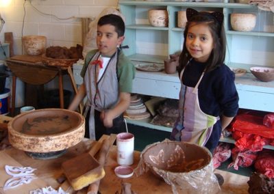 children making clay pots